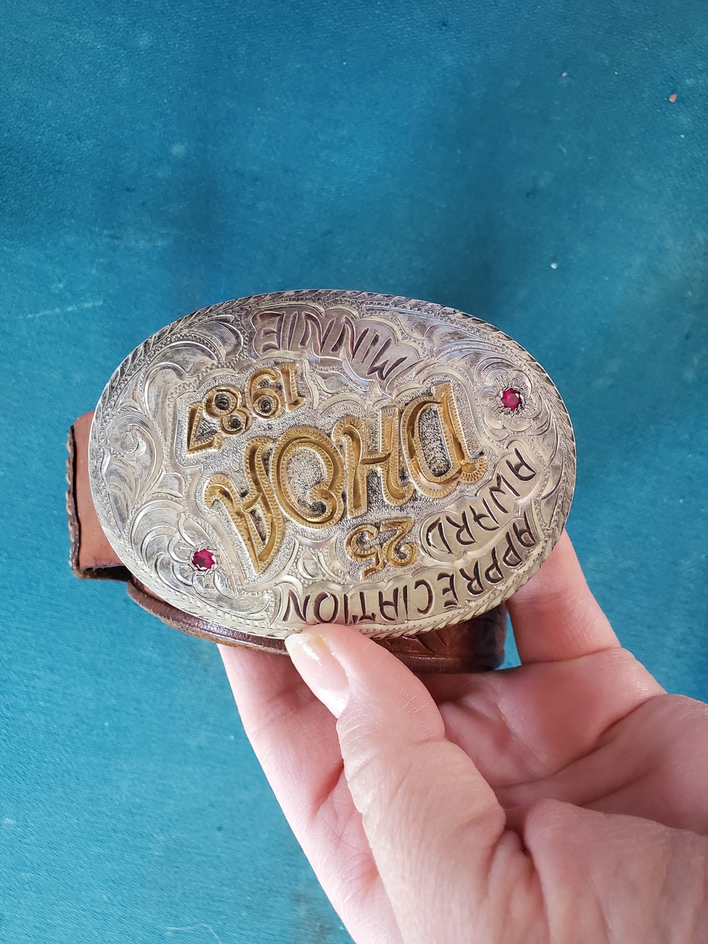 Vintage 1987 Gold and Silver Western-Style Oval Belt Buckle with Red Accents